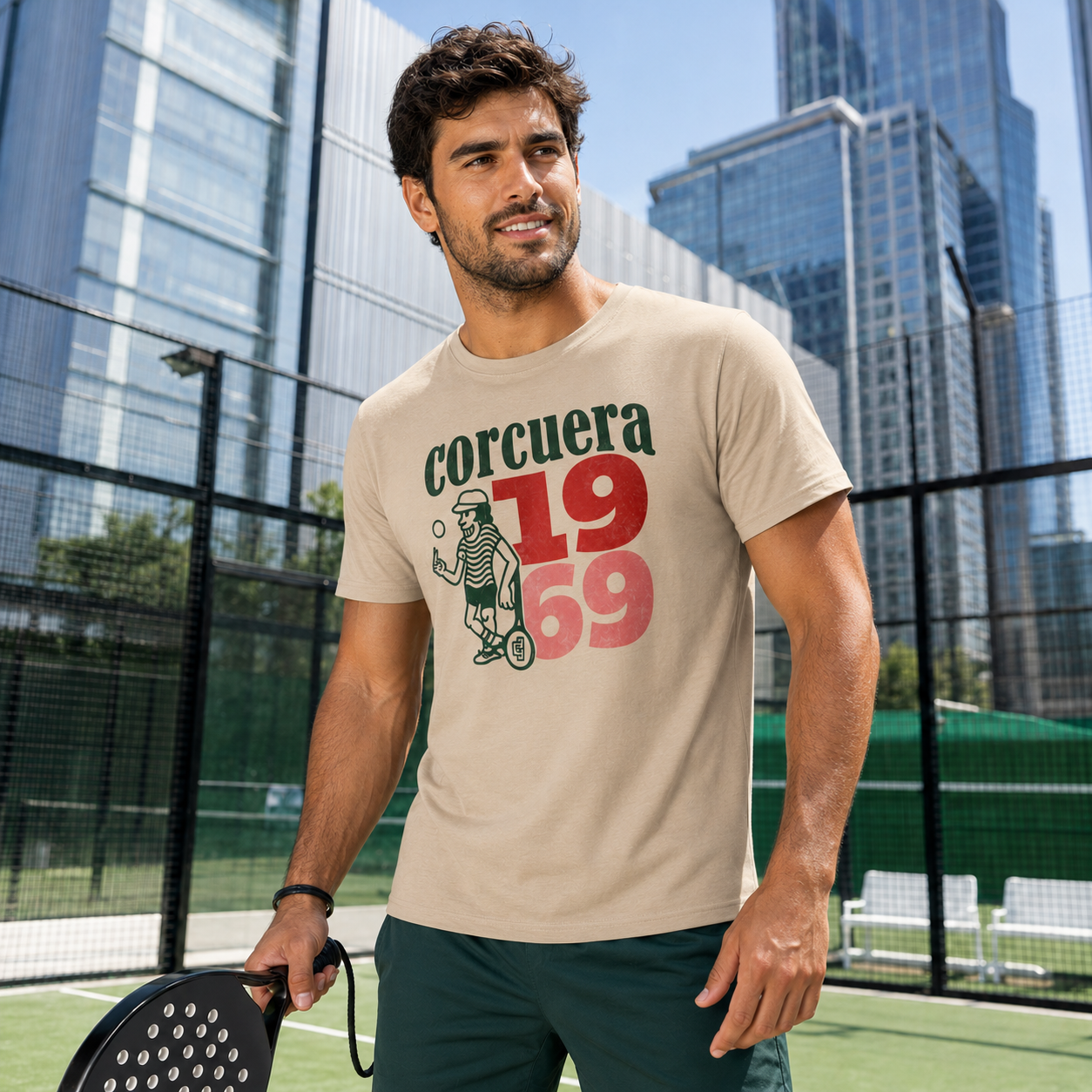 Spanish padel player in Corcuera 1969 desert dust T-shirt on outdoor padel court.